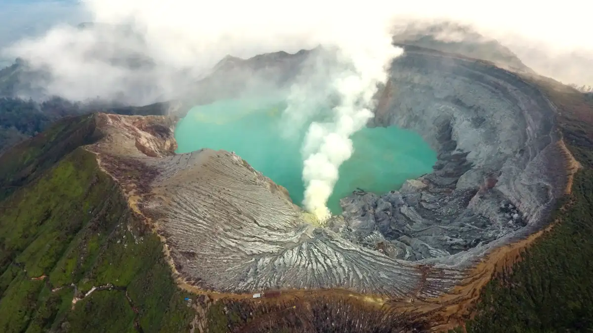 Ijen Crater acidic turquoise lake and blue fire phenomena